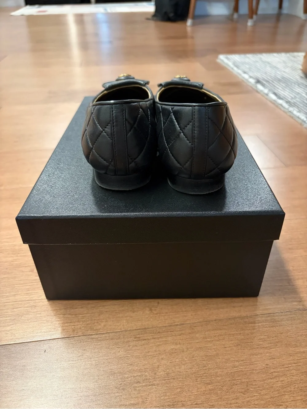 CHANEL Black Quilted Leather Ballet Flats with Gold CC Plaque